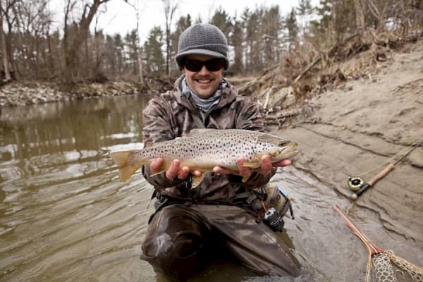 Holding a fish caught by the Clearwater