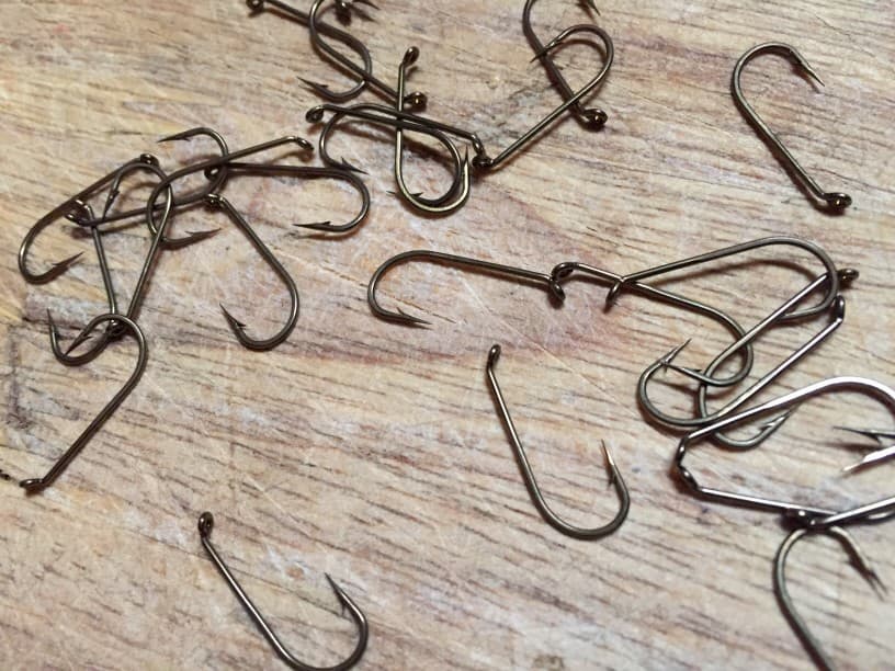 Fishing hooks laying on a table