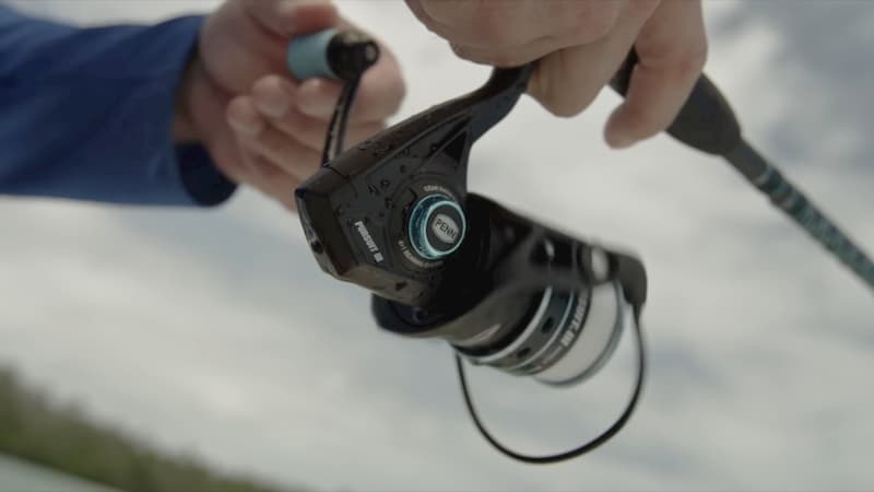 The Pursuit 3 spinning reel being used by an angler.