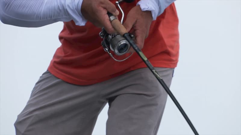 Man fishing with the St Croix spinning fishing reel