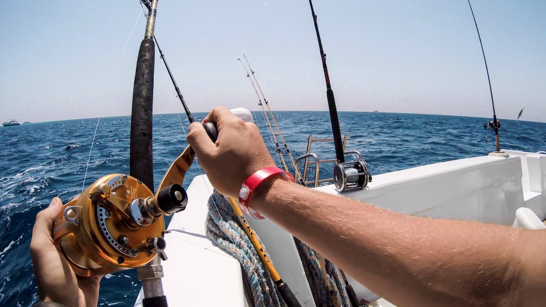 Man ocean fishing on a boat